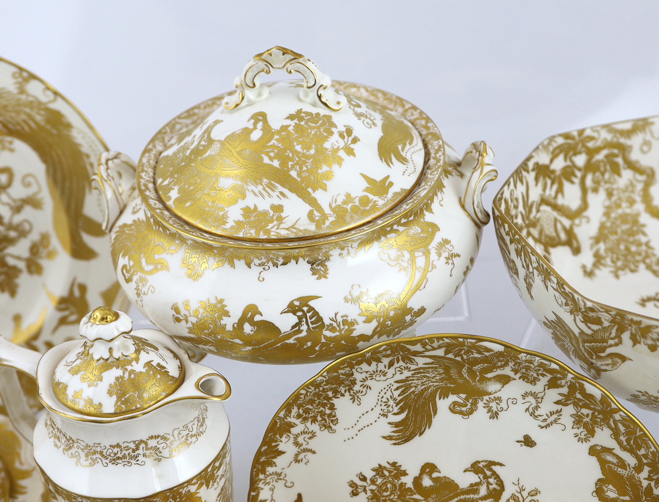 An extensive Royal Crown Derby Gold Aves dinner and tea service